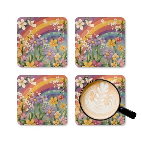 Set of coasters with pastel rainbow colors floral print with a rainbow in the background. Shown with a mug for scale.