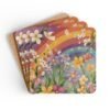 Set of coasters with pastel rainbow colors floral print with a rainbow in the background. Shown stacked on a table.