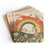 Set of coasters with sage and terracotta colors floral print with a rainbow in the background. Shown stacked on a table.