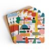 Square coaster with a multicolor mid century shapes design printed on it. Shown on a table.