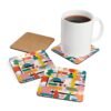 Square coaster with a multicolor mid century shapes design printed on it. Shown with a mug for scale.