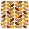 Square coaster with mid century modern leaf design in tan, brown, orange and olive green.