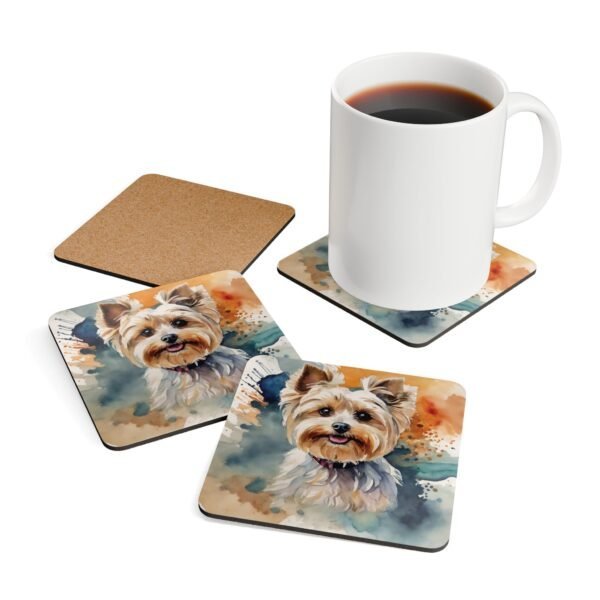 Set of four square coasters with a watercolor style image of a Yorkie dog printed on them. Shown with a mug for scale.
