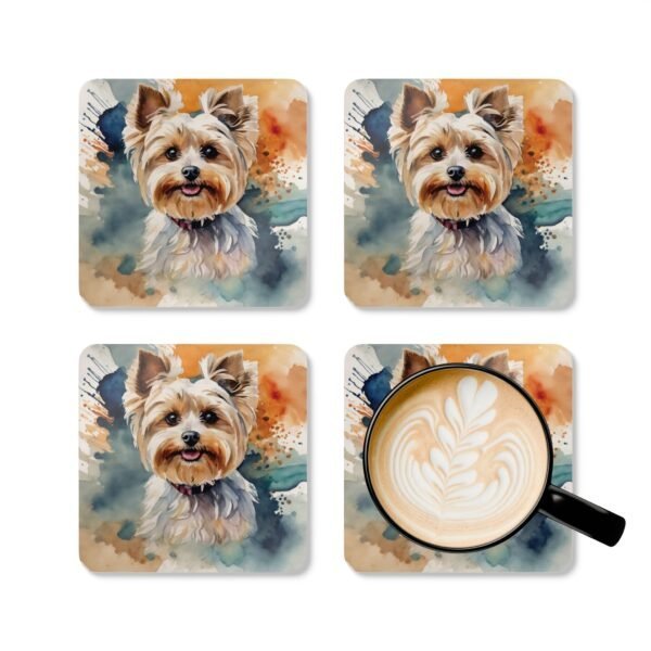 Set of four square coasters with a watercolor style image of a Yorkie dog printed on them. Shown with a mug for scale.