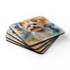 Set of four square coasters with a watercolor style image of a Yorkie dog printed on them. Shown stacked on a table.