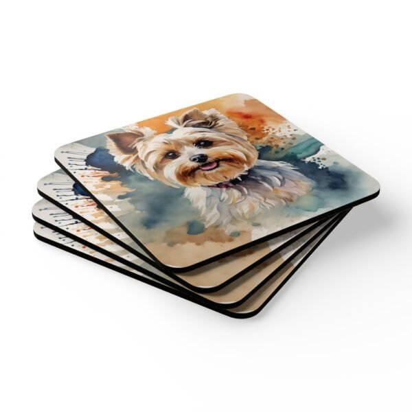 Set of four square coasters with a watercolor style image of a Yorkie dog printed on them. Shown stacked on a table.