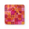 Stack of square cork‑backed coasters featuring a bold geometric pattern in pink, orange, and red tones. The design includes circles, triangles, and abstract shapes arranged in a retro grid style.