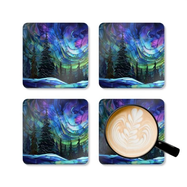 Square coaster set featuring a stained‑glass style design of evergreen trees under swirling aurora lights in shades of blue, green, and purple. Shown with a mug for scale.
