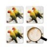 Set of four square coaster with image of a pair of Sun Conure parrots in watercolor style. Shown with mug for scale.