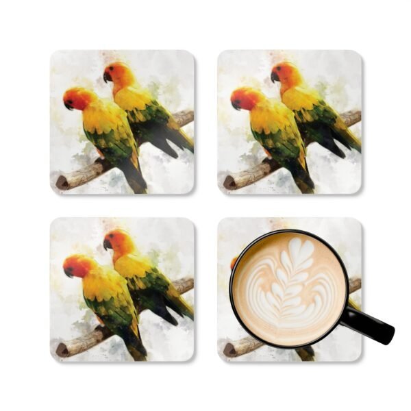 Set of four square coaster with image of a pair of Sun Conure parrots in watercolor style. Shown with mug for scale.